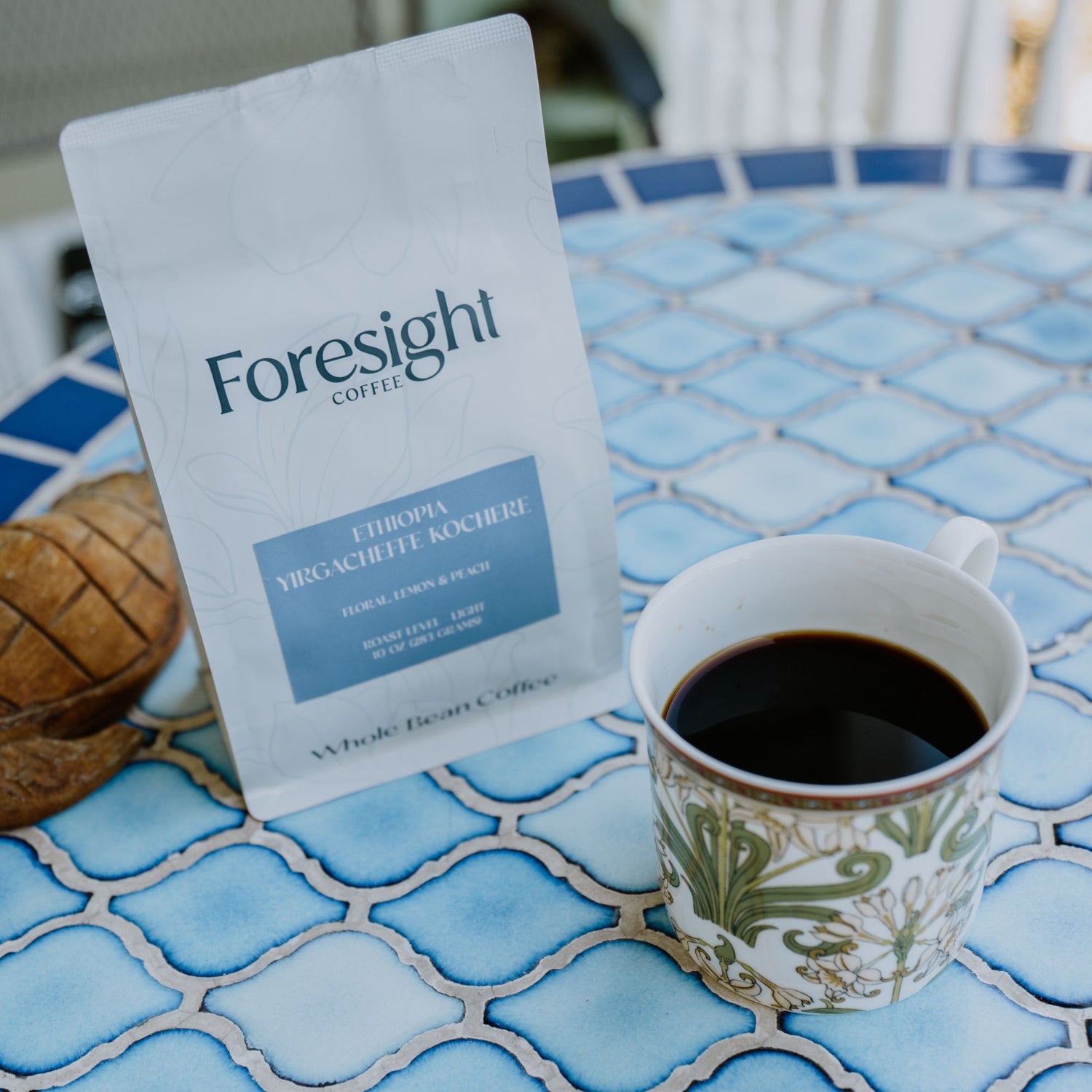 Foresight Coffee single origin bag next to coffee cup