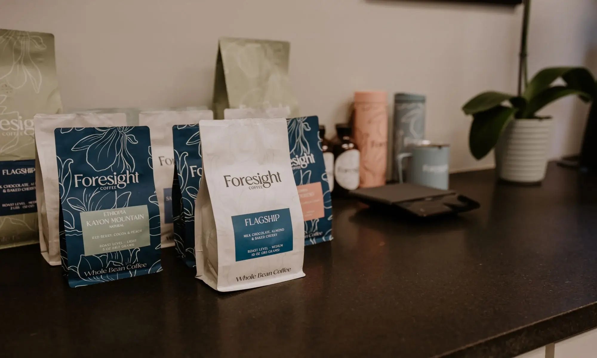 Foresight coffee bags on set and merchandise looks blurred in the back